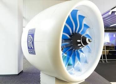 RR share price visual with a Rolls-Royce aircraft engine and rising stock market chart